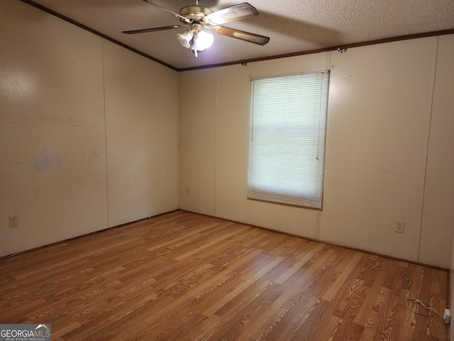 715 Bailey Jester Rd, Griffin, GA 30224 - empty room with light wood-type flooring, ceiling fan, crown molding, and a textured ceiling