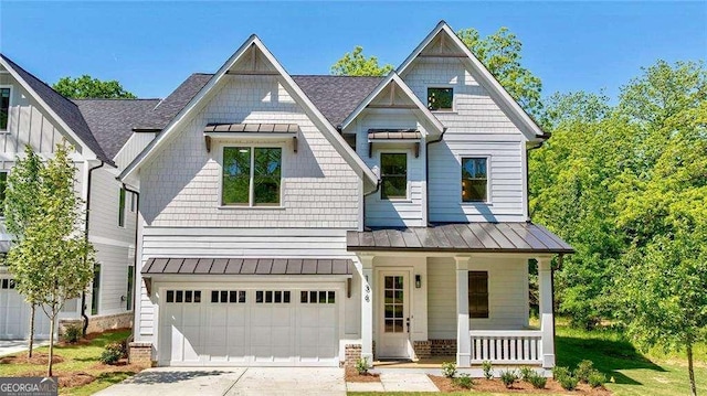 136 Beutell St, Norcross, GA 30071 - craftsman-style house with covered porch, a standing seam roof, driveway, and metal roof