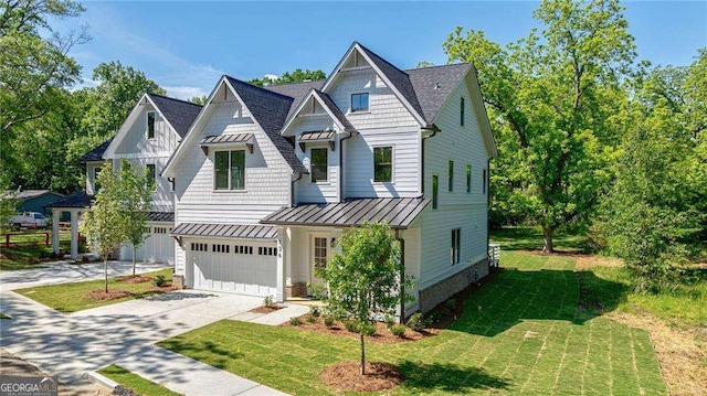 136 Beutell St, Norcross, GA 30071 - view of front of property with a standing seam roof, driveway, a garage, and a front yard