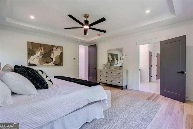 136 Beutell St, Norcross, GA 30071 - bedroom featuring a raised ceiling, light wood-style flooring, recessed lighting, and ceiling fan