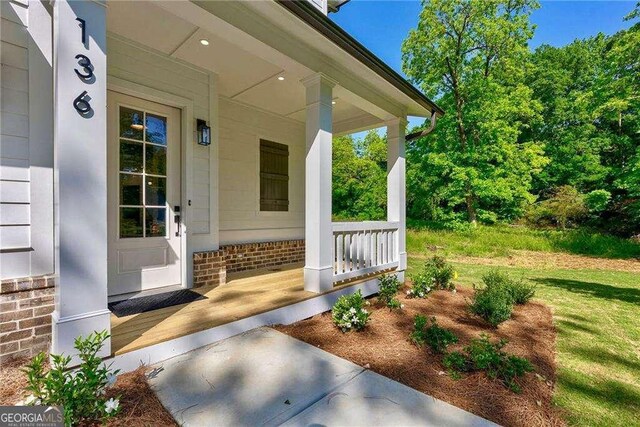 136 Beutell St, Norcross, GA 30071 - entrance to property with a porch and brick siding