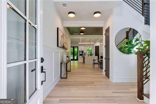 136 Beutell St, Norcross, GA 30071 - entryway featuring light wood finished floors, baseboards, and stairs