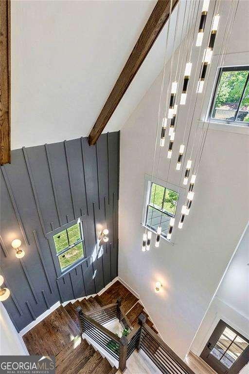 136 Beutell St, Norcross, GA 30071 - stairway featuring wood finished floors and beamed ceiling