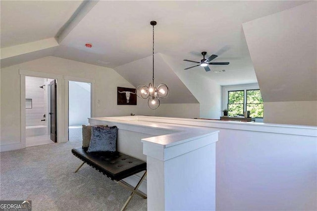 136 Beutell St, Norcross, GA 30071 - kitchen with lofted ceiling, a ceiling fan, carpet, pendant lighting, and a chandelier