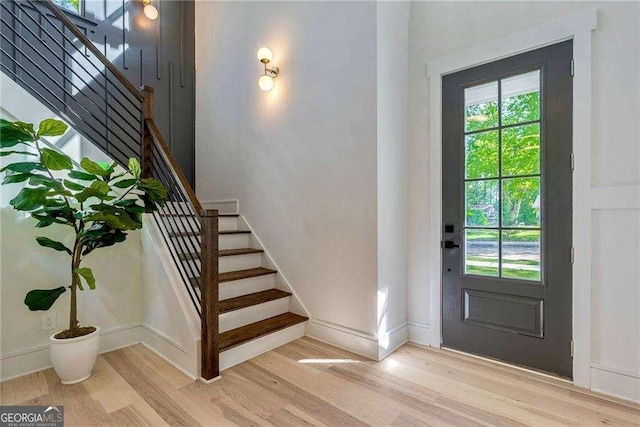 136 Beutell St, Norcross, GA 30071 - entryway with wood finished floors, stairs, and baseboards