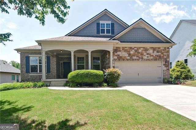 514 Creekshire Cir, Canton, GA 30115 - craftsman inspired home with a front yard, concrete driveway, covered porch, a garage, and stone siding
