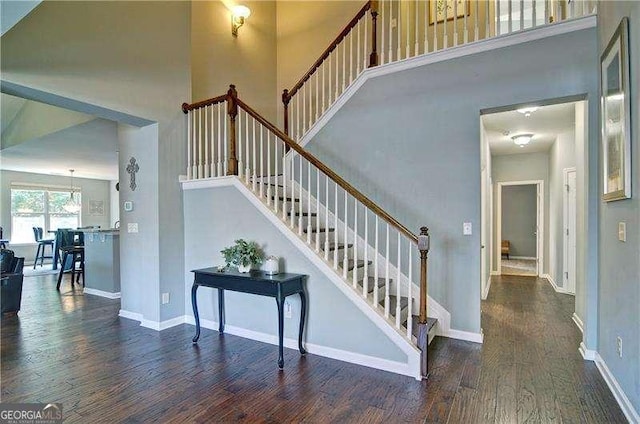 514 Creekshire Cir, Canton, GA 30115 - stairs with wood finished floors, a towering ceiling, and baseboards