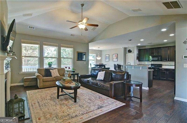 514 Creekshire Cir, Canton, GA 30115 - living area featuring lofted ceiling, a ceiling fan, dark wood finished floors, baseboards, and a fireplace