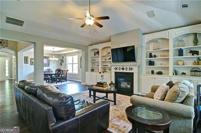 514 Creekshire Cir, Canton, GA 30115 - living room with dark wood finished floors, a ceiling fan, a glass covered fireplace, baseboards, and arched walkways