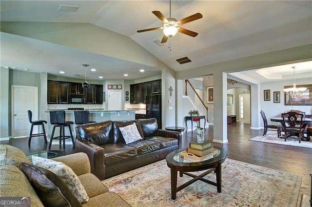 514 Creekshire Cir, Canton, GA 30115 - living room featuring baseboards, lofted ceiling, stairway, dark wood-type flooring, and a ceiling fan