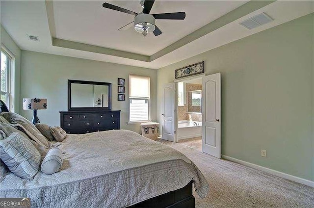 514 Creekshire Cir, Canton, GA 30115 - bedroom featuring multiple windows, baseboards, light carpet, and a tray ceiling