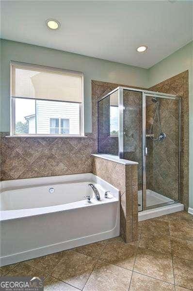 514 Creekshire Cir, Canton, GA 30115 - bathroom with a stall shower, tile patterned flooring, a bath, and recessed lighting