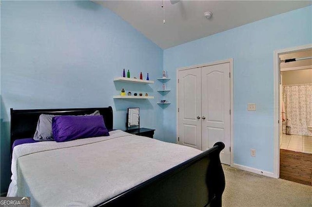 514 Creekshire Cir, Canton, GA 30115 - bedroom featuring vaulted ceiling, a closet, light colored carpet, and baseboards