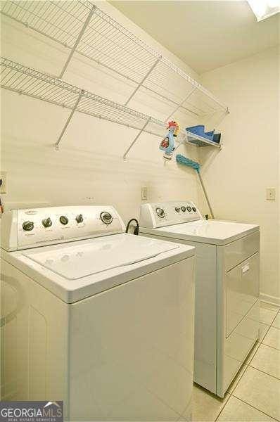 514 Creekshire Cir, Canton, GA 30115 - laundry room featuring washer and clothes dryer and light tile patterned flooring