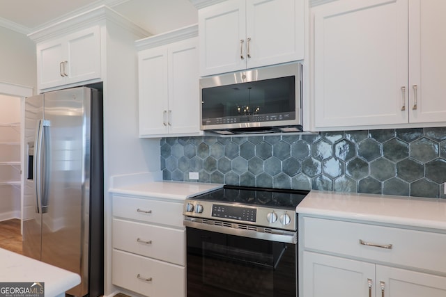 3916 Bull Run, Valdosta, GA 31605 - kitchen with appliances with stainless steel finishes, light countertops, white cabinets, and crown molding