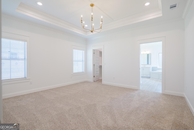 3916 Bull Run, Valdosta, GA 31605 - empty room with a raised ceiling, ornamental molding, a chandelier, light colored carpet, and healthy amount of natural light