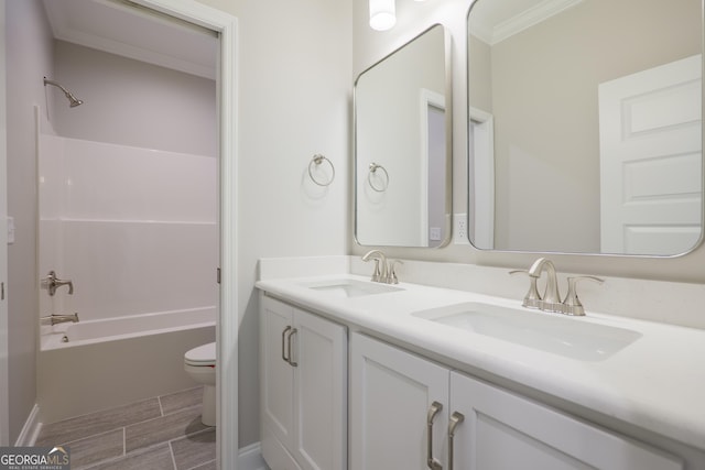 3916 Bull Run, Valdosta, GA 31605 - bathroom featuring ornamental molding, toilet, double vanity, tub / shower combination, and wood finish floors