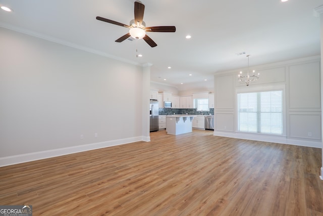 3916 Bull Run, Valdosta, GA 31605 - unfurnished living room with a chandelier, recessed lighting, ornamental molding, ceiling fan, and light wood-style floors