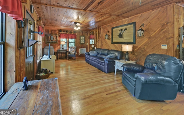 living room featuring wooden ceiling, wood walls, ceiling fan, wood finished floors, and a wall mounted AC