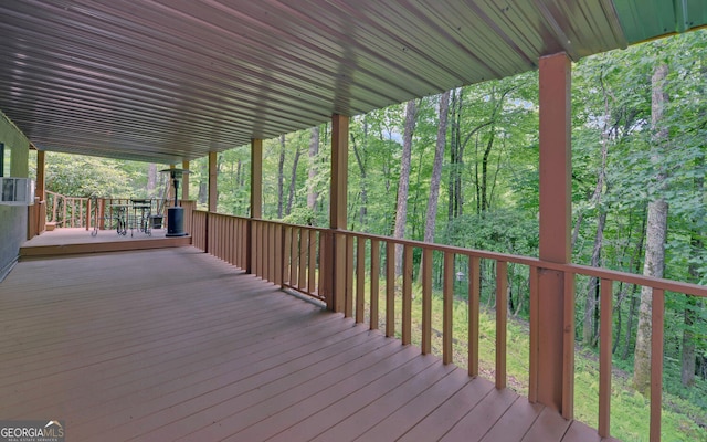 wooden deck featuring a wooded view