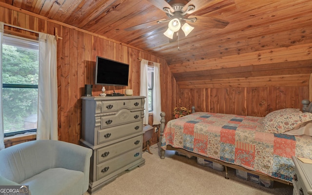 bedroom with wooden ceiling, wooden walls, carpet, lofted ceiling, and a ceiling fan