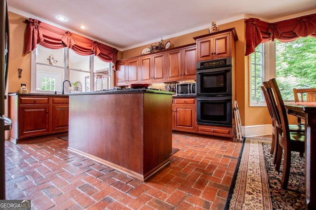 98 Sweetbriar Ln, Carrollton, GA 30117 - kitchen with crown molding, recessed lighting, brick floors, baseboards, and a kitchen island
