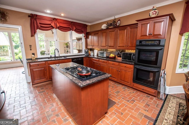 98 Sweetbriar Ln, Carrollton, GA 30117 - kitchen with a sink, black appliances, recessed lighting, brick flooring, and a kitchen island