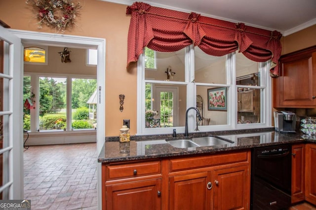 98 Sweetbriar Ln, Carrollton, GA 30117 - kitchen featuring a sink, brick floors, dark stone counters, plenty of natural light, and crown molding