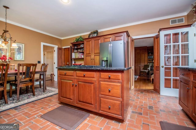 98 Sweetbriar Ln, Carrollton, GA 30117 - kitchen with stainless steel fridge with ice dispenser, brick floors, open shelves, ornamental molding, and decorative light fixtures