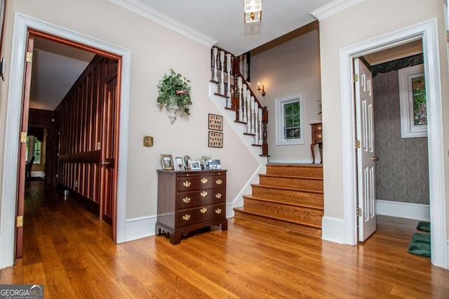 98 Sweetbriar Ln, Carrollton, GA 30117 - entryway featuring wood finished floors, stairway, ornamental molding, and baseboards