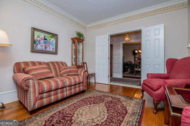 98 Sweetbriar Ln, Carrollton, GA 30117 - living area with wood-type flooring, crown molding, and a chandelier