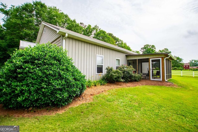 98 Sweetbriar Ln, Carrollton, GA 30117 - rear view of property featuring a sunroom and board and batten siding