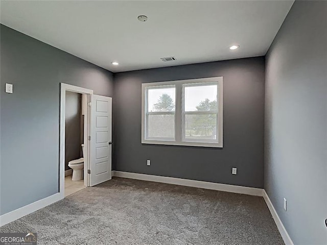 629 Windsor St, Atlanta, GA 30312 - unfurnished bedroom featuring carpet floors, recessed lighting, and ensuite bathroom