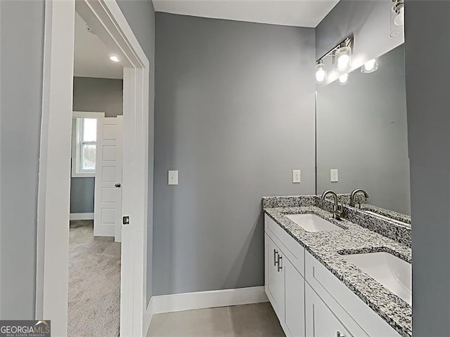 629 Windsor St, Atlanta, GA 30312 - bathroom featuring double vanity and baseboards