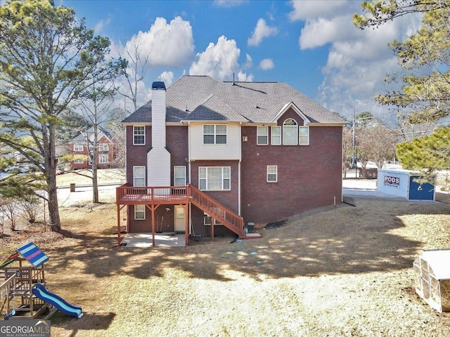 101 Lumby Ln, Stockbridge, GA 30281 - rear view of property with a deck, stairway, a chimney, a patio, and brick siding