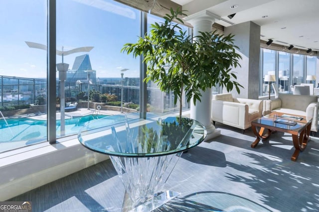 3344 Peachtree Rd NE Unit 3601, Atlanta, GA 30326 - sunroom featuring plenty of natural light, a swimming pool, and a view of city