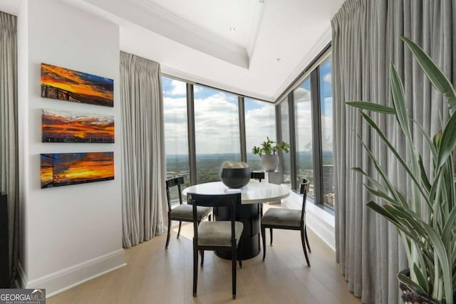 3344 Peachtree Rd NE Unit 3601, Atlanta, GA 30326 - dining space with light wood-style floors, expansive windows, ornamental molding, and baseboards