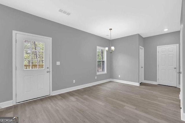 3614 Griffin Dr, Gainesville, GA 30506 - unfurnished dining area featuring a chandelier, healthy amount of natural light, wood finished floors, and recessed lighting