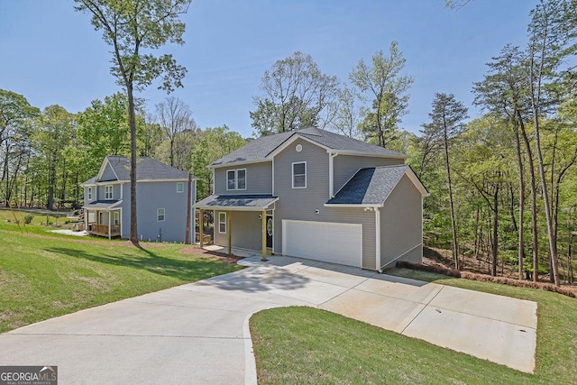 3614 Griffin Dr, Gainesville, GA 30506 - view of front of house featuring a garage, driveway, a front yard, and a porch