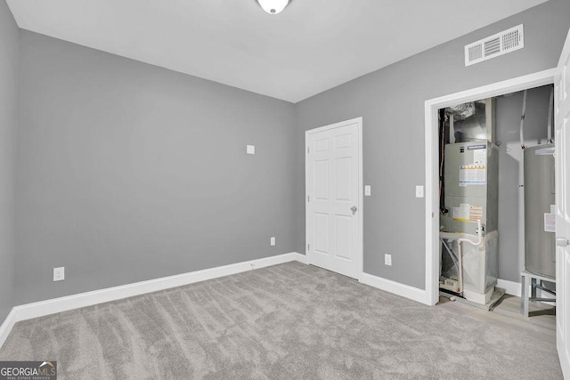 3614 Griffin Dr, Gainesville, GA 30506 - unfurnished bedroom with baseboards, carpet floors, heating unit, and water heater