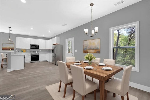 3614 Griffin Dr, Gainesville, GA 30506 - dining space featuring plenty of natural light, light wood-type flooring, a chandelier, recessed lighting, and baseboards