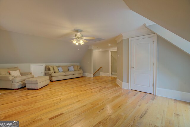 bonus room featuring vaulted ceiling, wood finished floors, ceiling fan, and baseboards