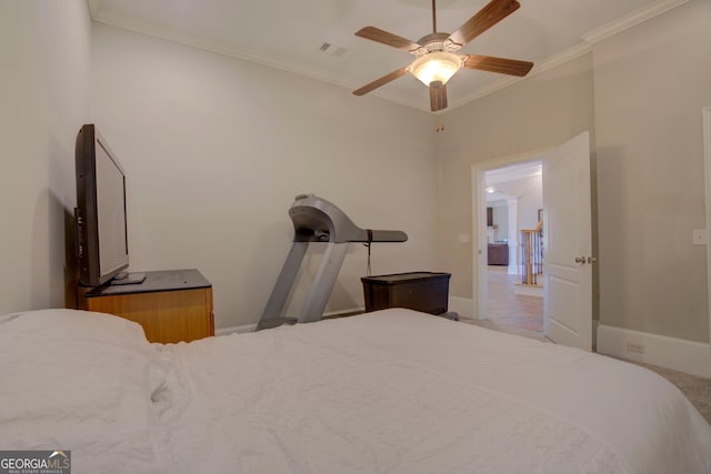 bedroom featuring ornamental molding, baseboards, and ceiling fan