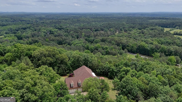 view of subject property featuring a forest