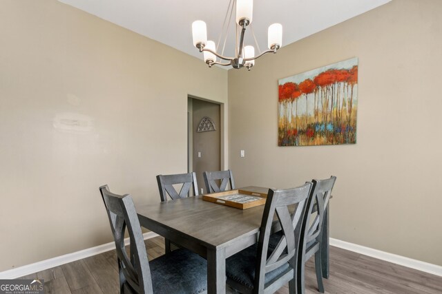 103 Olson Way, Kingsland, GA 31548 - dining room with a chandelier, wood finished floors, and baseboards