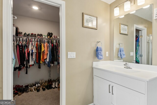 103 Olson Way, Kingsland, GA 31548 - bathroom with vanity and a walk in closet