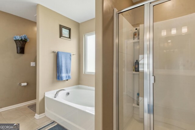 103 Olson Way, Kingsland, GA 31548 - full bath with a shower stall, a garden tub, tile patterned flooring, and baseboards
