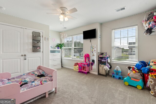 103 Olson Way, Kingsland, GA 31548 - carpeted bedroom featuring a closet, a ceiling fan, and baseboards