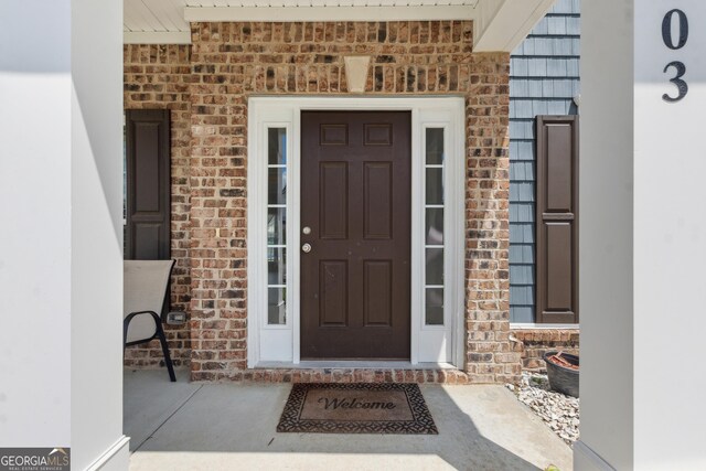 103 Olson Way, Kingsland, GA 31548 - doorway to property featuring brick siding