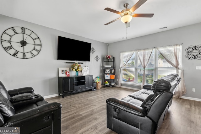 103 Olson Way, Kingsland, GA 31548 - living room with ceiling fan, wood finished floors, and baseboards
